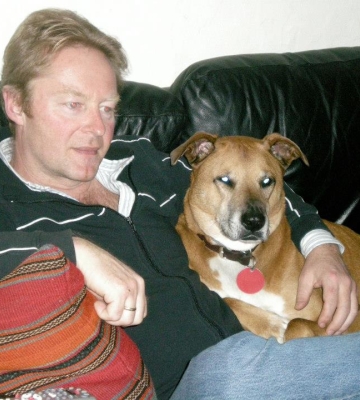 Photo of Jeremy McInerney, a white man, with a dog